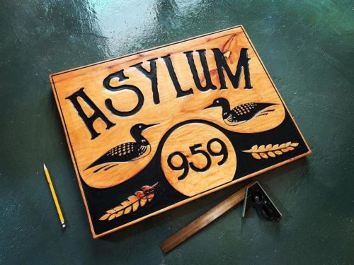 asylum wooden sign