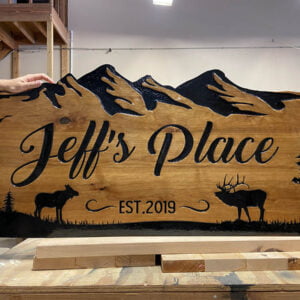 Cabin Sign with Unique Edge and Mountain Imagery