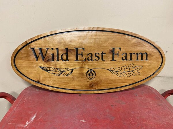 Oval Farm Sign with Feather Imagery